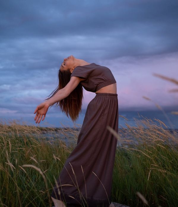 Woman in a graceful movement pose, embodying harmony and balance.